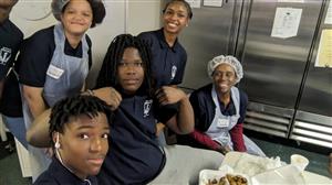 students in the Soup Kitchen with Teacher Ms. Scott